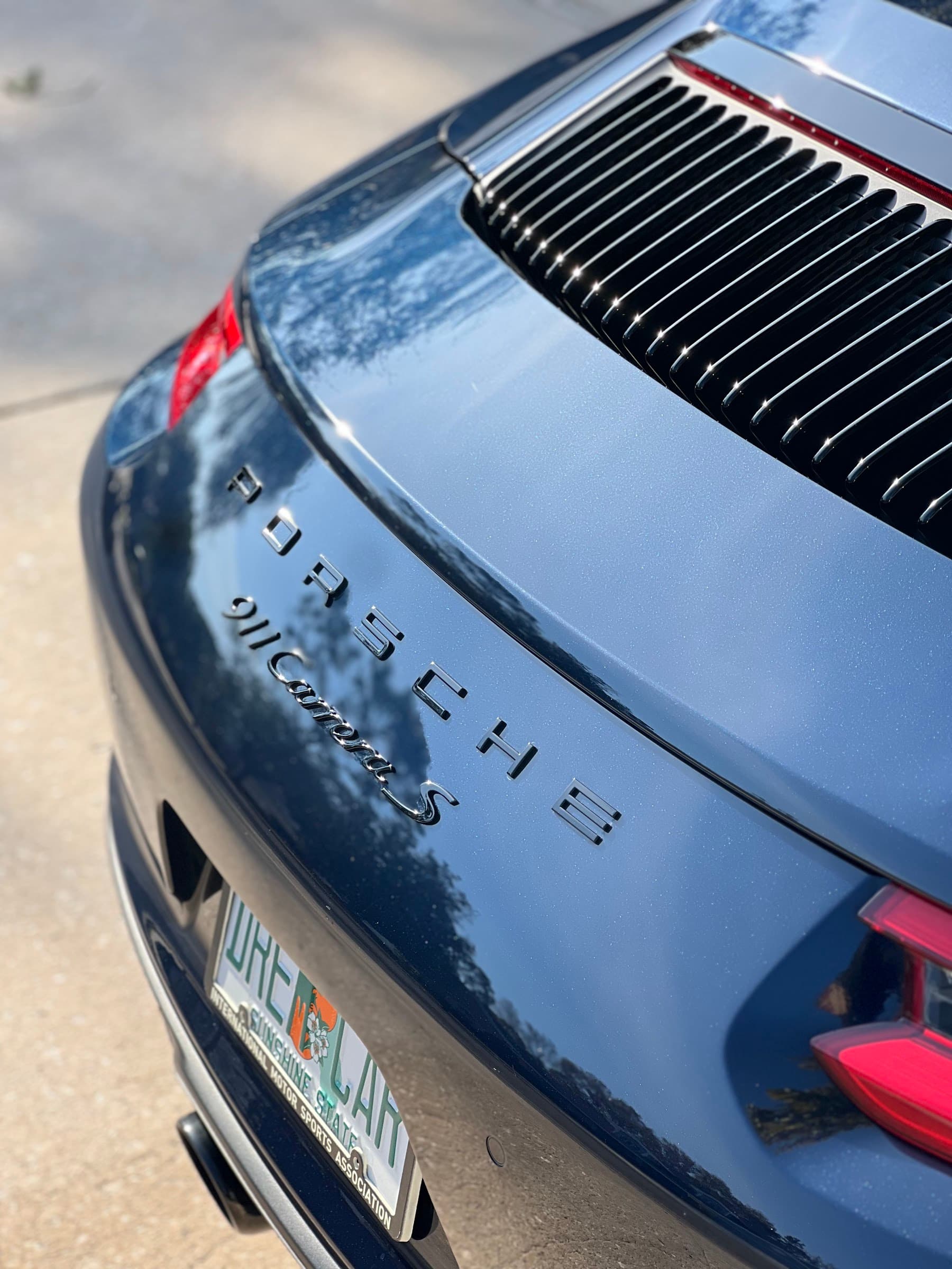 Exterior detailing on luxury sedan in Tampa
